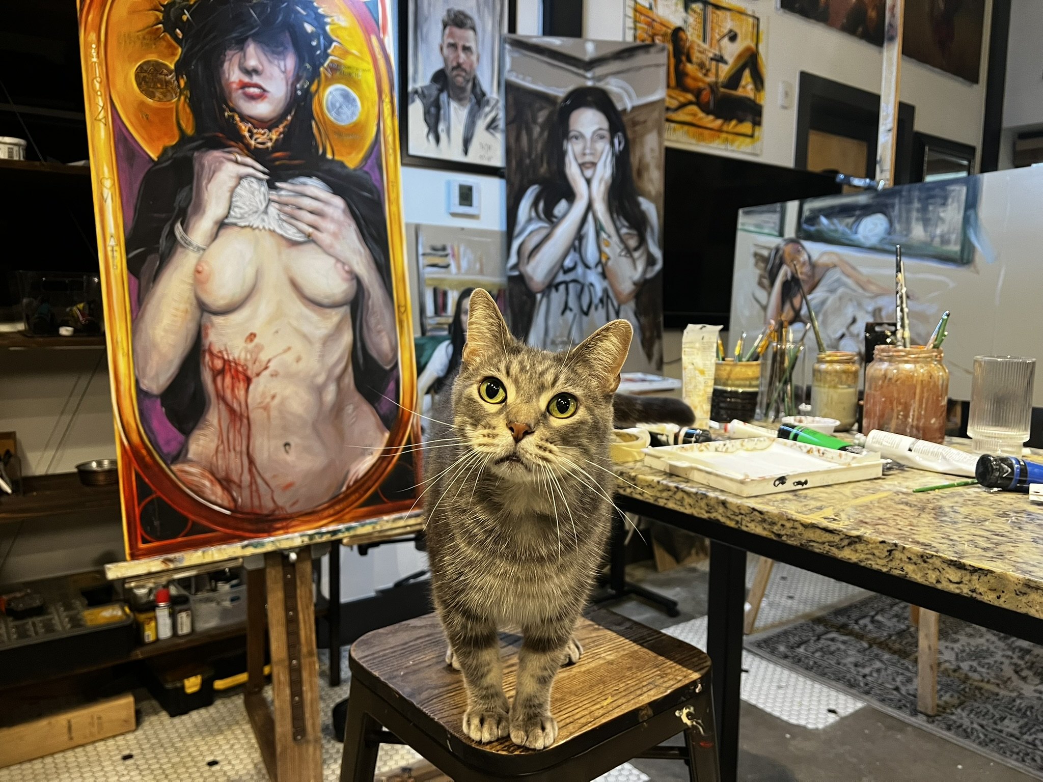 William Inder's studio — the cat keeping watch over the work on the easel